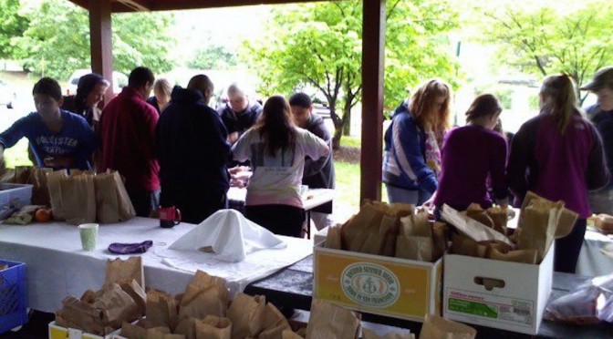 Preparing hygiene kits and lunches in Candler Park for distribution to Atlanta's homeless.